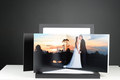 SUNSET BRIDE AND GROOM PHOTO IN A WEDDING ALBUM WITH A BACK BOX