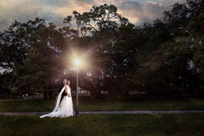 Portrait of the bride and groom at sunset with a light