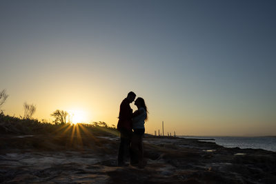 Silhouette at sunset is a gorgeous photograph for couple