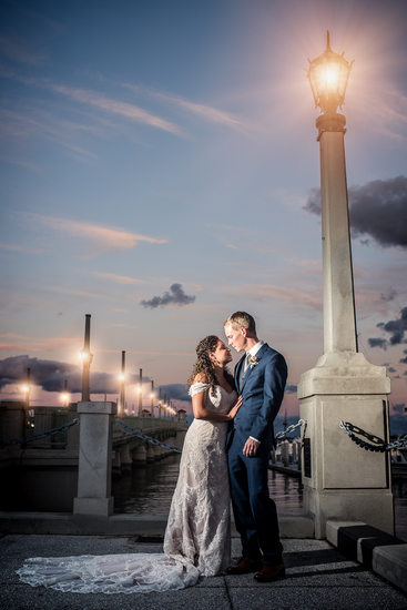 Bride and groom on the Bridge of Lions at sunset in st Augustine