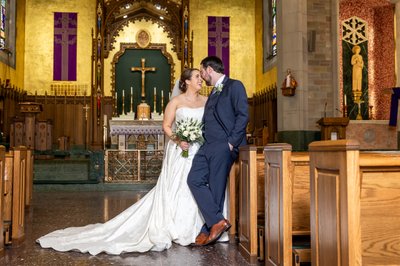 Stunning bride and groom church portrait