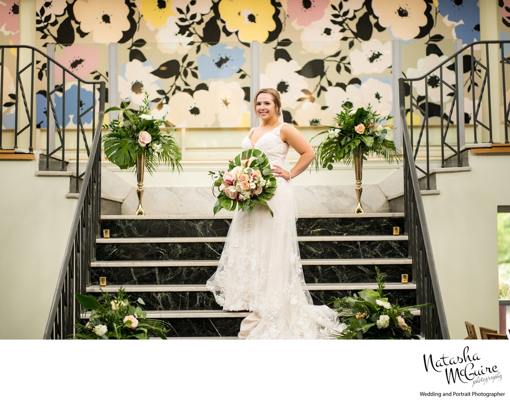 Bride on staircase at Majorette wedding venue 