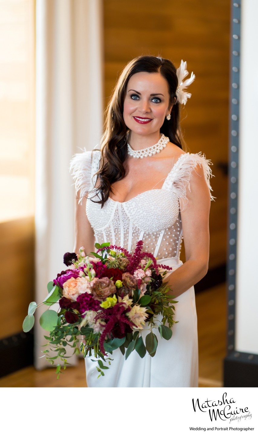 Bridal portrait after hair and makeup in her suite.