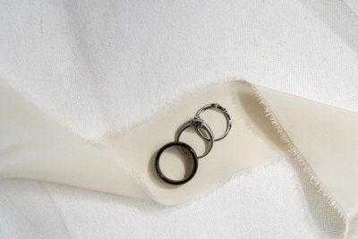 Wedding rings styled on silk ribbon by Natasha McGuire