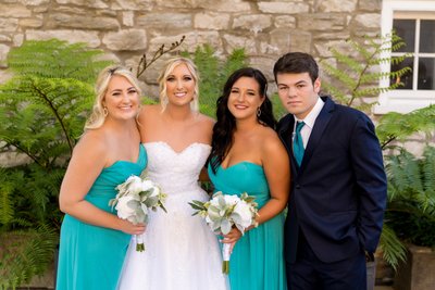 Bride with siblings at Stone House of St Charles