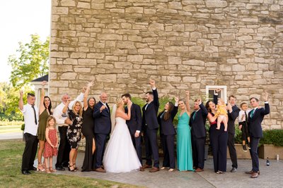 Large candid family photo at St Charles wedding