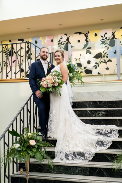 Couple on staircase at Majorette wedding venue