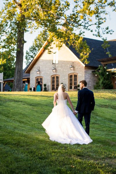 Wedding couple walking property in St Charles, MO
