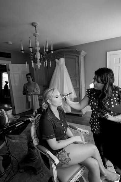 Bride getting makeup done at Stone House of St Charles