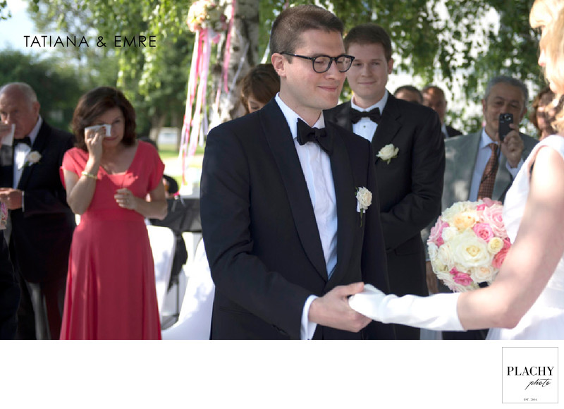 Wedding ceremony in garden bride groom crying mom behind