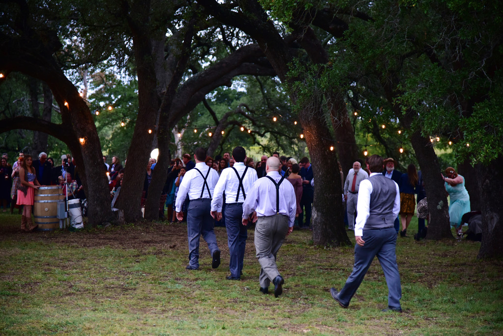 Grooms marching to the wedding ceremony William Chris Hill Country 