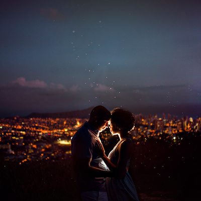 Beautiful nighttime picture of a couple embracing.