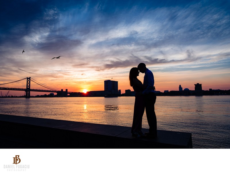 Silhouette of Couple kissing at their engagement session