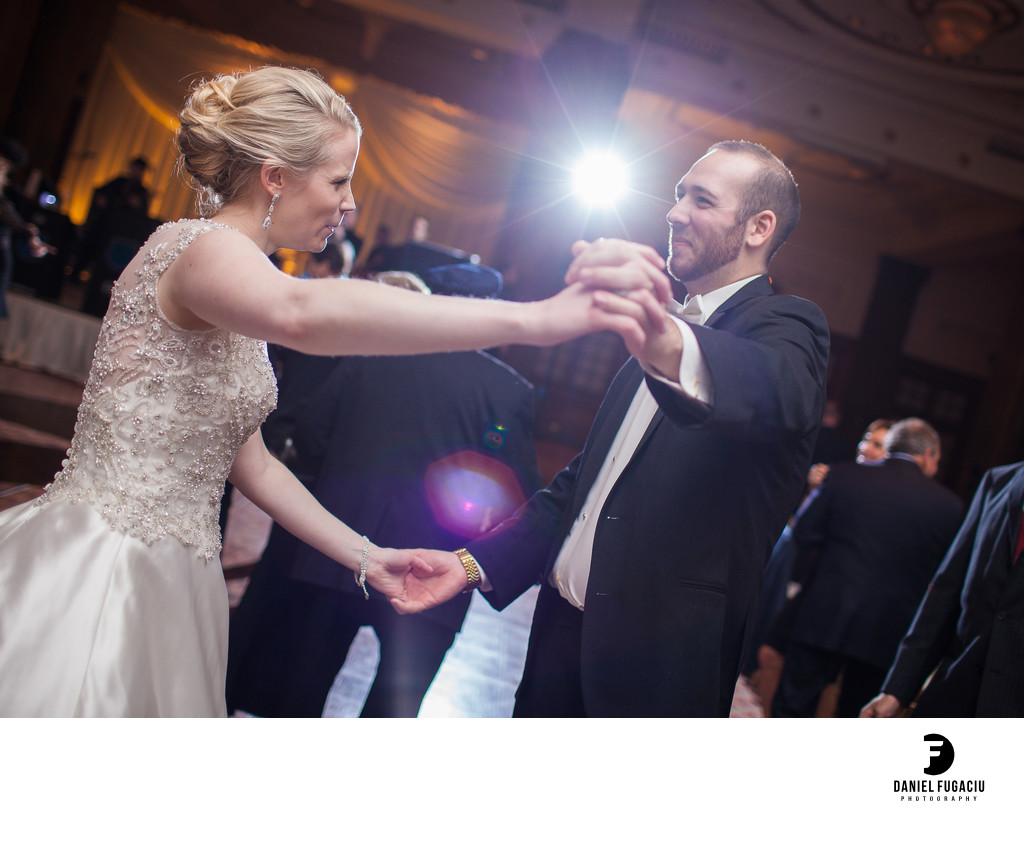 Happy bride and groom dance at Crystal 