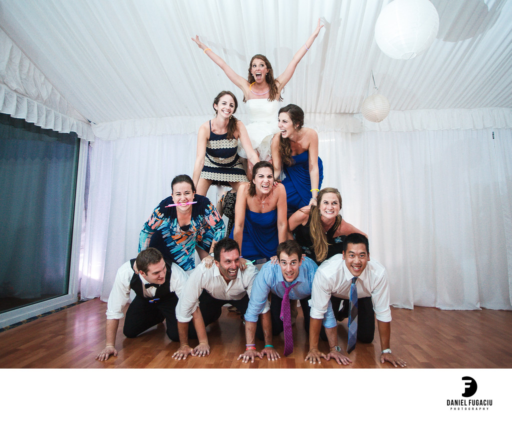 Cheerleader Pyramid made of wedding guests and bride on top