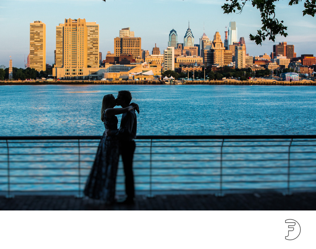 A hug and a kiss in front of the Philadelphia skyline