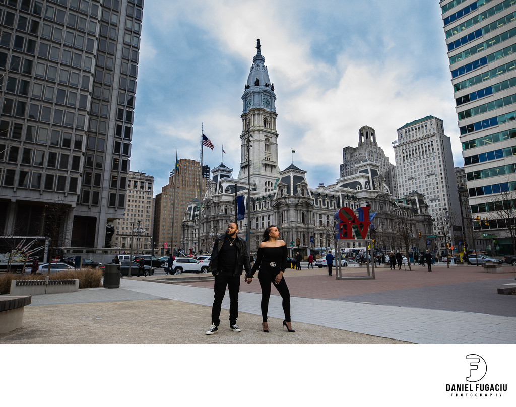 Engaged couple holding hands at Philadelphia City Hall