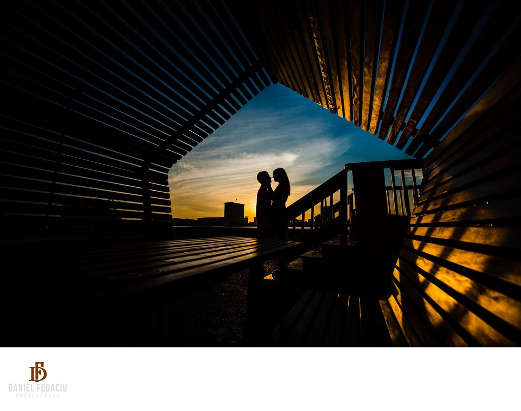 Silhouette of an engaged couple at sunrise