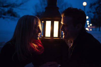 Engagement portrait by street lamp