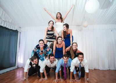 Cheerleader Pyramid made of wedding guests and bride on top