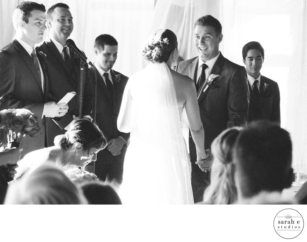 Candid Black and White Wedding Photograph During Ceremony