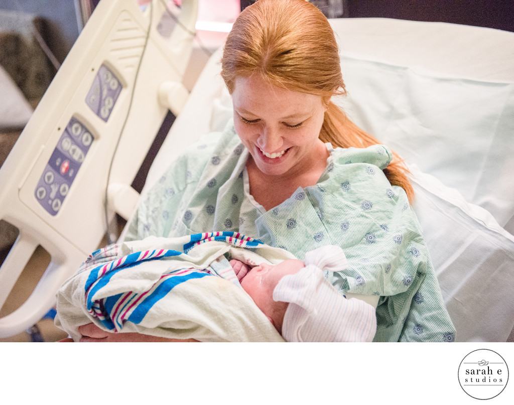 Surrogate Birth Mom Holding Newborn Baby Girl in St. Louis