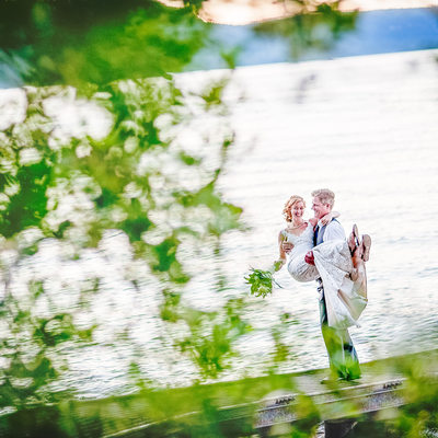 Epic Photo of Bride and Groom on Dock at Lake