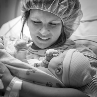 Mom Holding Baby at Mercy Hospital in St. Louis