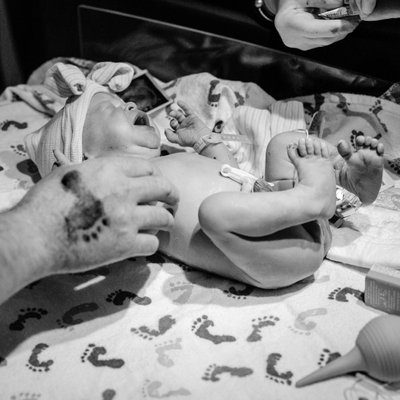 Ink Footprint on Dad During Birth Story in St. Louis