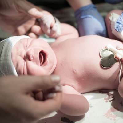 Baby After Birth Holding Dad Fingers