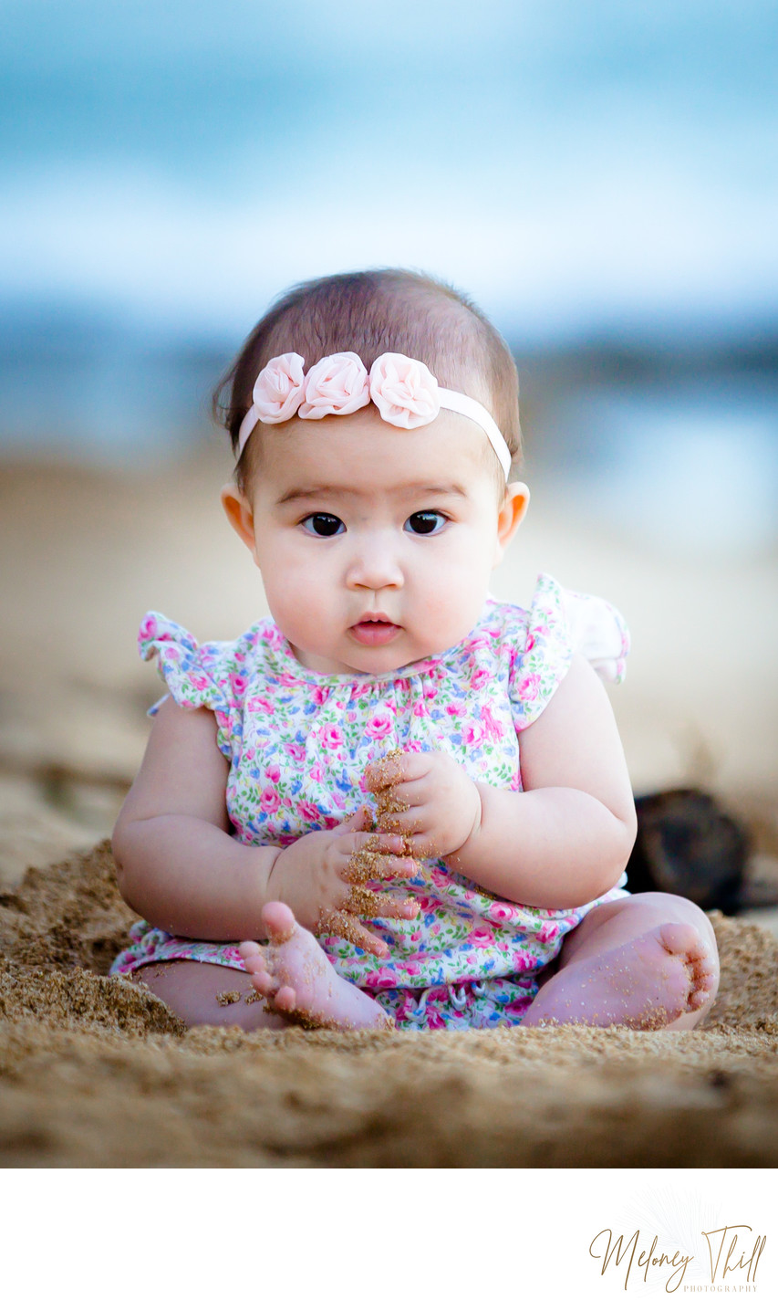 1 year old playing in the sand