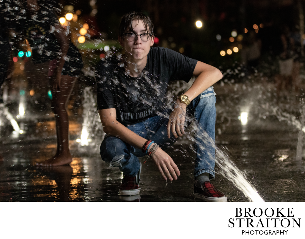 Night photoshoot with teen in fountains