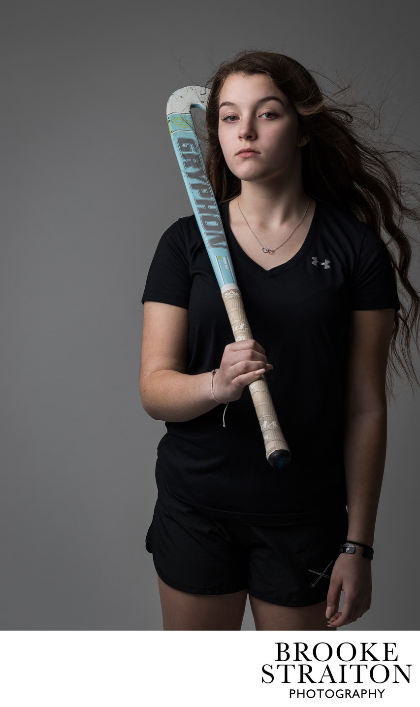 Girl with a hockey stick, lifestyle shot photography