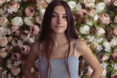 Teen photoshoot with flower wall