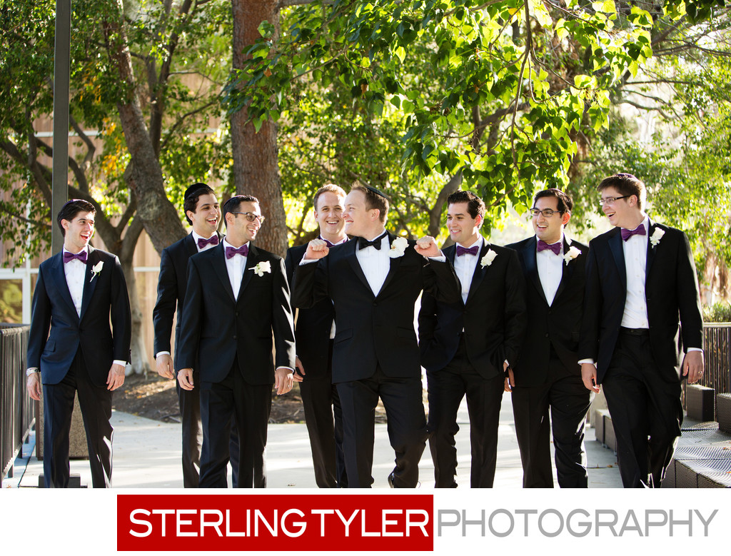 groom with groomsmen laughing wedding photograph