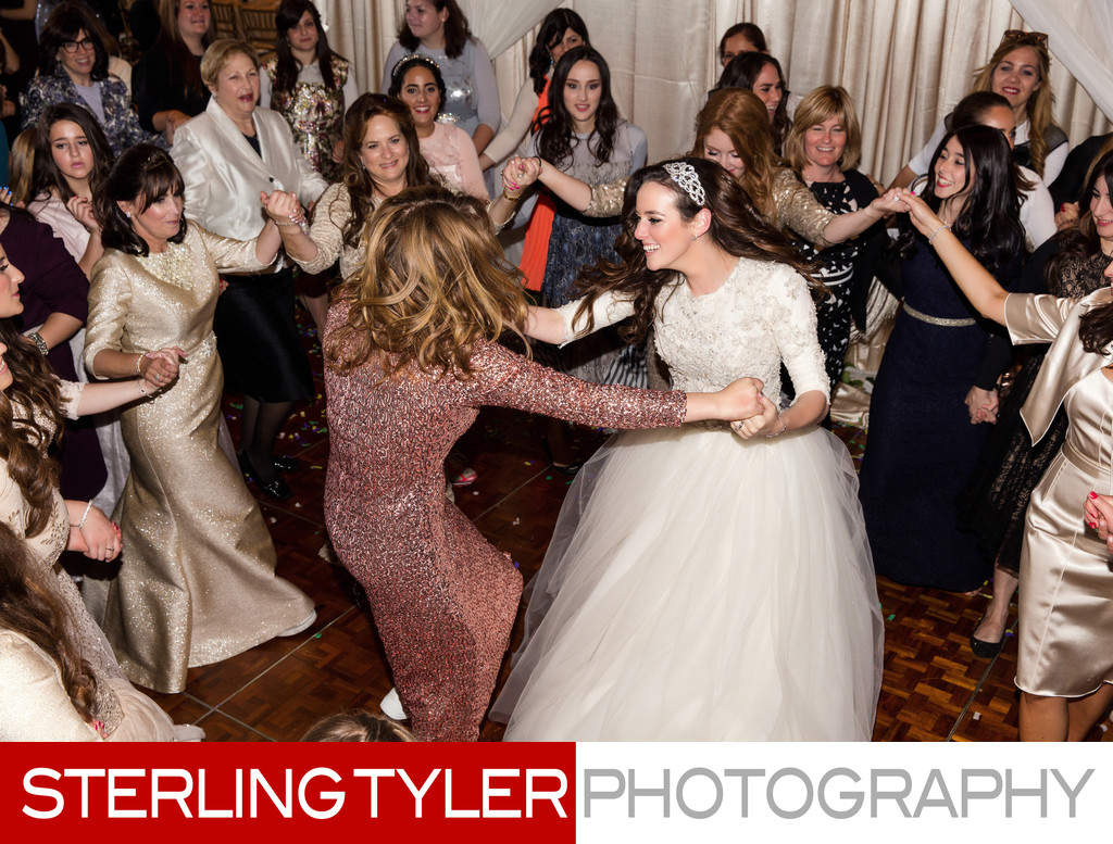 bride dancing with friends at orthodox jewish wedding los angeles