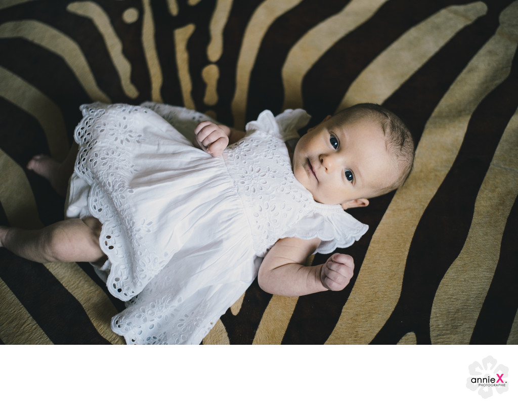 Baby girl on zebra rug in lahontan