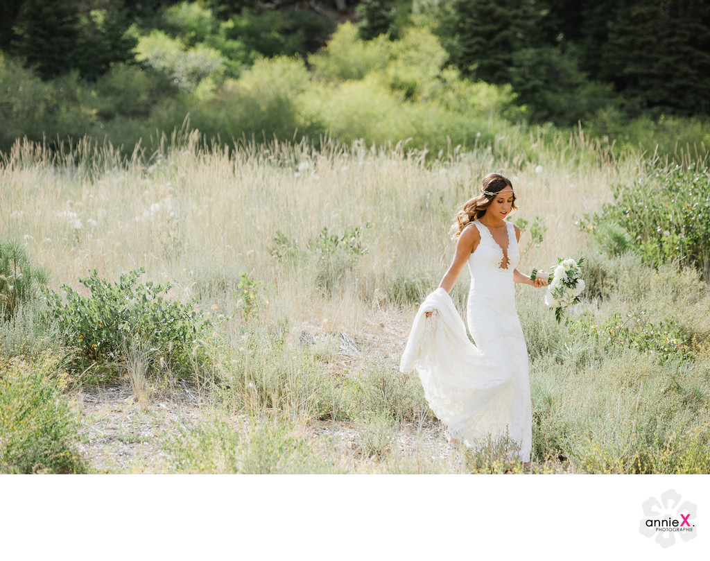 Bride walking in field at Ritz Carlton