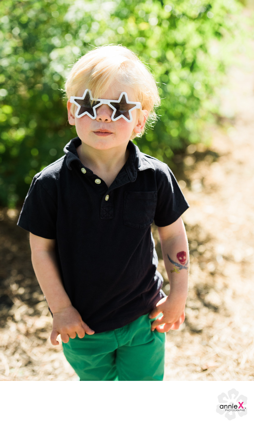 Blond boy with star sunglasses
