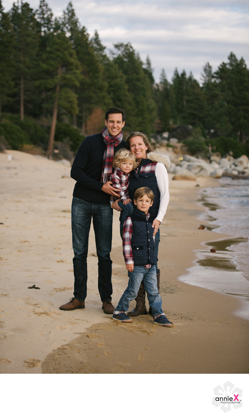 Family in plaid on beach in Lake Tahoe

