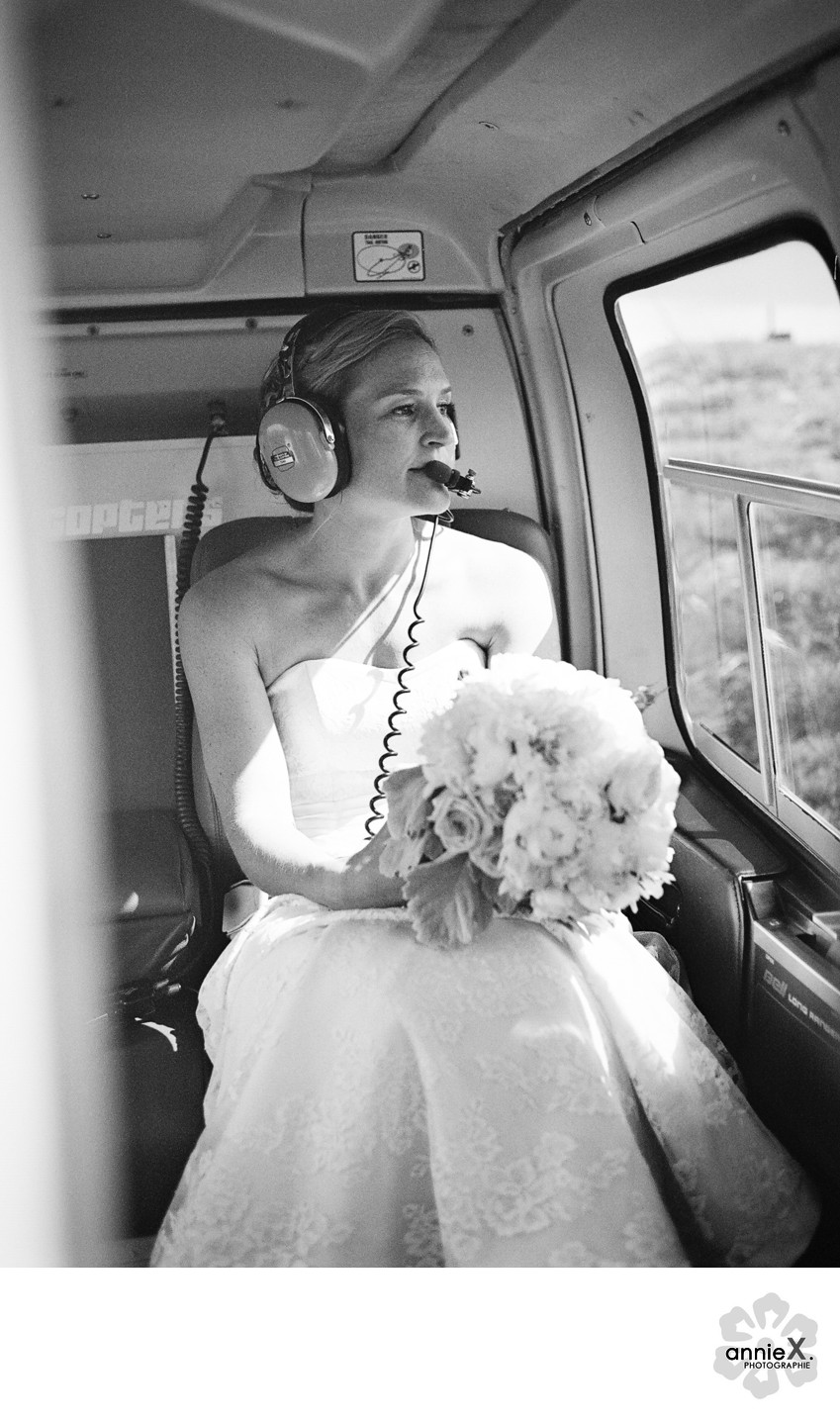 bride with earphones in helicopter during flight