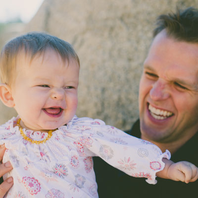 Father and baby girl laughing in Lake Tahoe