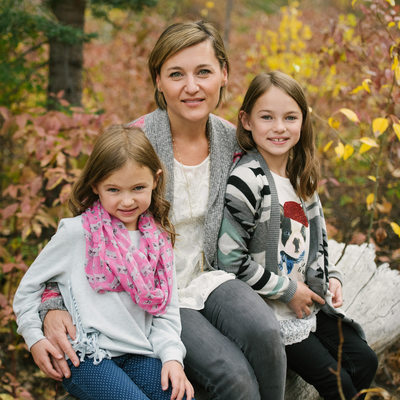 Mother and daughters with fall foliage