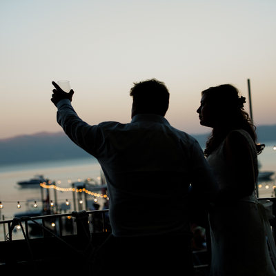 Sunset toast bride and groom at West Shore cafe