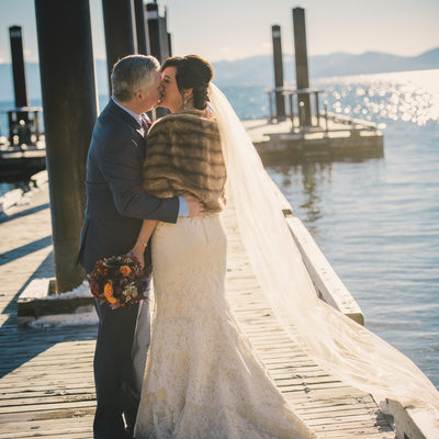 Hyatt pier in winter with bride and groom