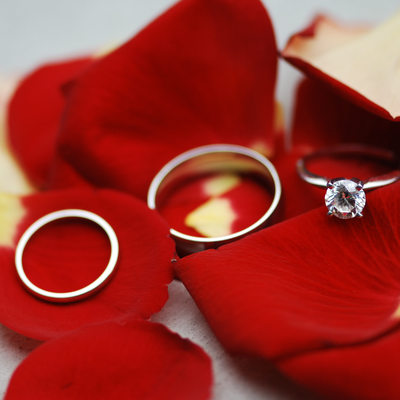 wedding rings on petals