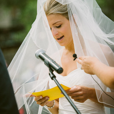 bride reading vows at West Shore cafe