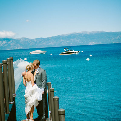 Newlyweds on West Shore cafe pier in Lake Tahoe