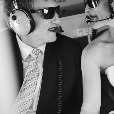Bride and groom during flight over mountain