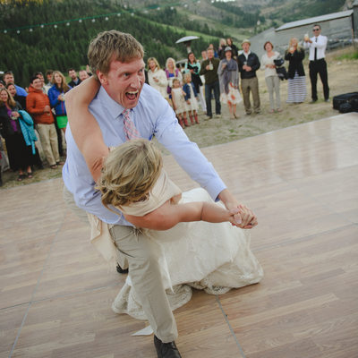 groom dipping bride during their first dance
